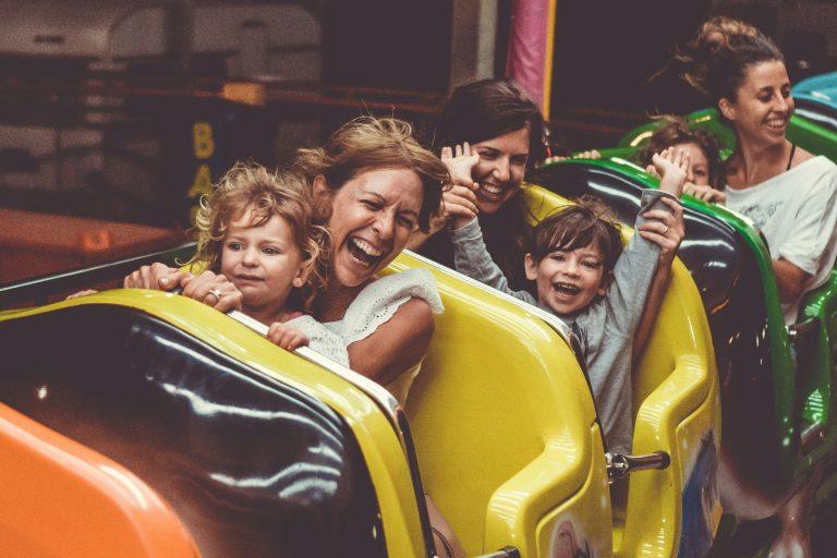 Image displays happy person in a roller coaster
