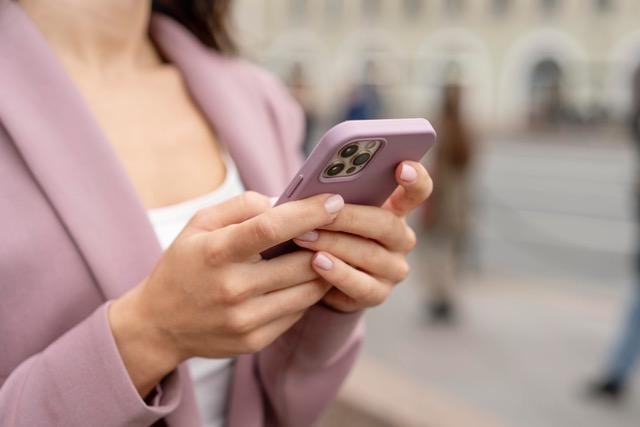 Image of a woman with a smartphone