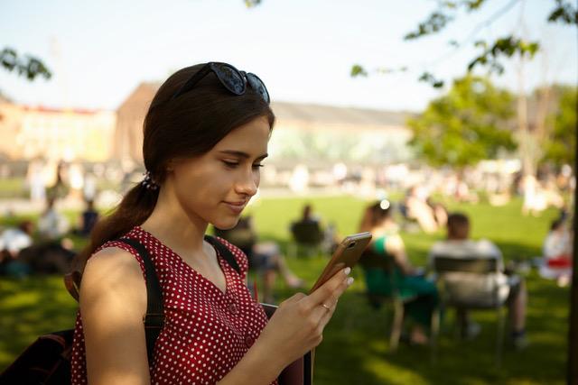 Image of a woman with a smartphone